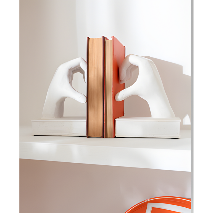 Ceramic bookends with a hand motif