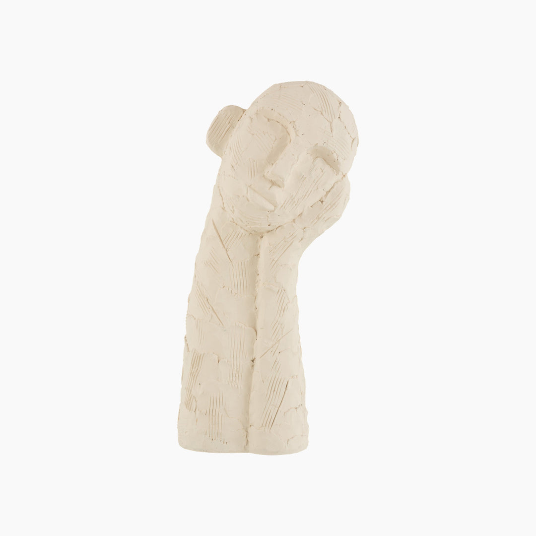 Cement sculpture with a leaning figure design