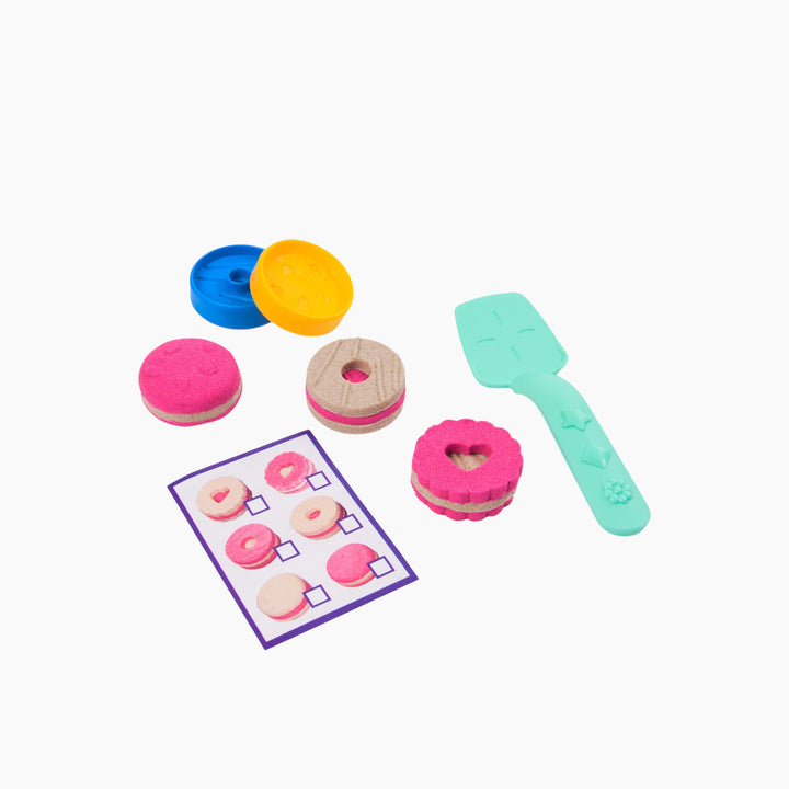 Spin Master Kinetic Sand cookie box toy with pink and brown sand