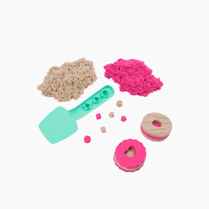 Spin Master Kinetic Sand cookie box toy with pink and brown sand