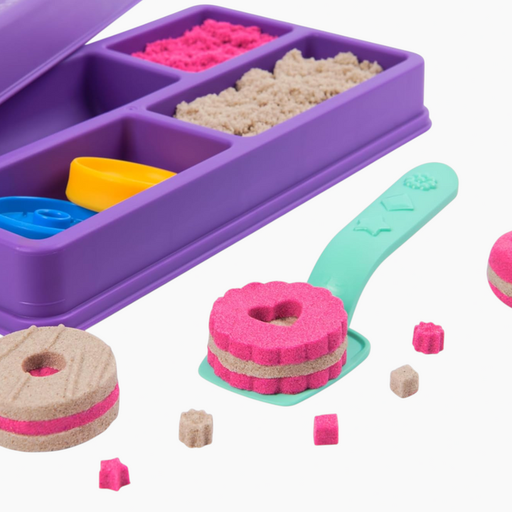 Spin Master Kinetic Sand cookie box toy with pink and brown sand