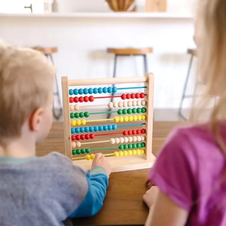 Wooden abacus with 100 colorful beads on a hardwood base