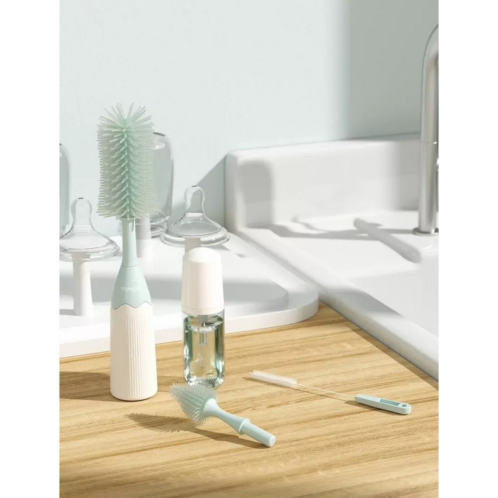 Momcozy bottle brush kit with innovative push-press design and silicone bristles