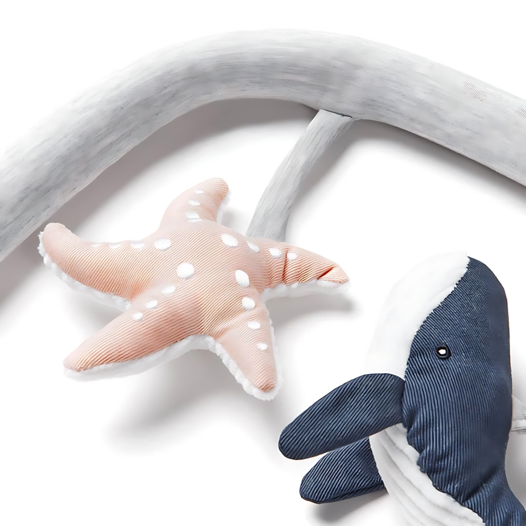Ergobaby Evolve Bouncer Toy Bar in light grey with plush ocean animals