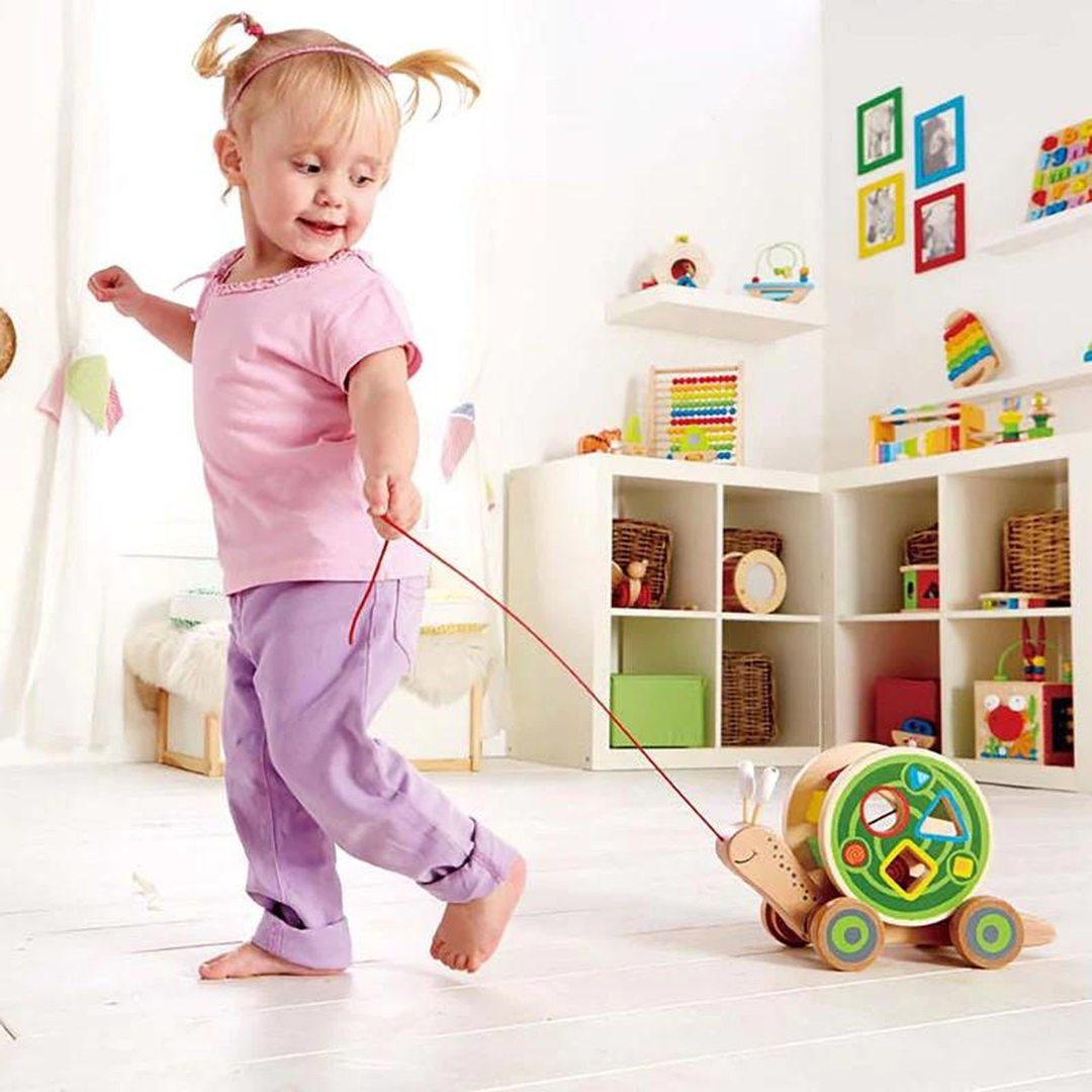 HapeWalk-A-LongSnail_WoodenPull-AlongSnailwithShapeSorterandStorageforToddlers6943478008816_12_framed_2c9f7108-31fe-4e0a-a6e8-74596bc1aec6 - HUNA