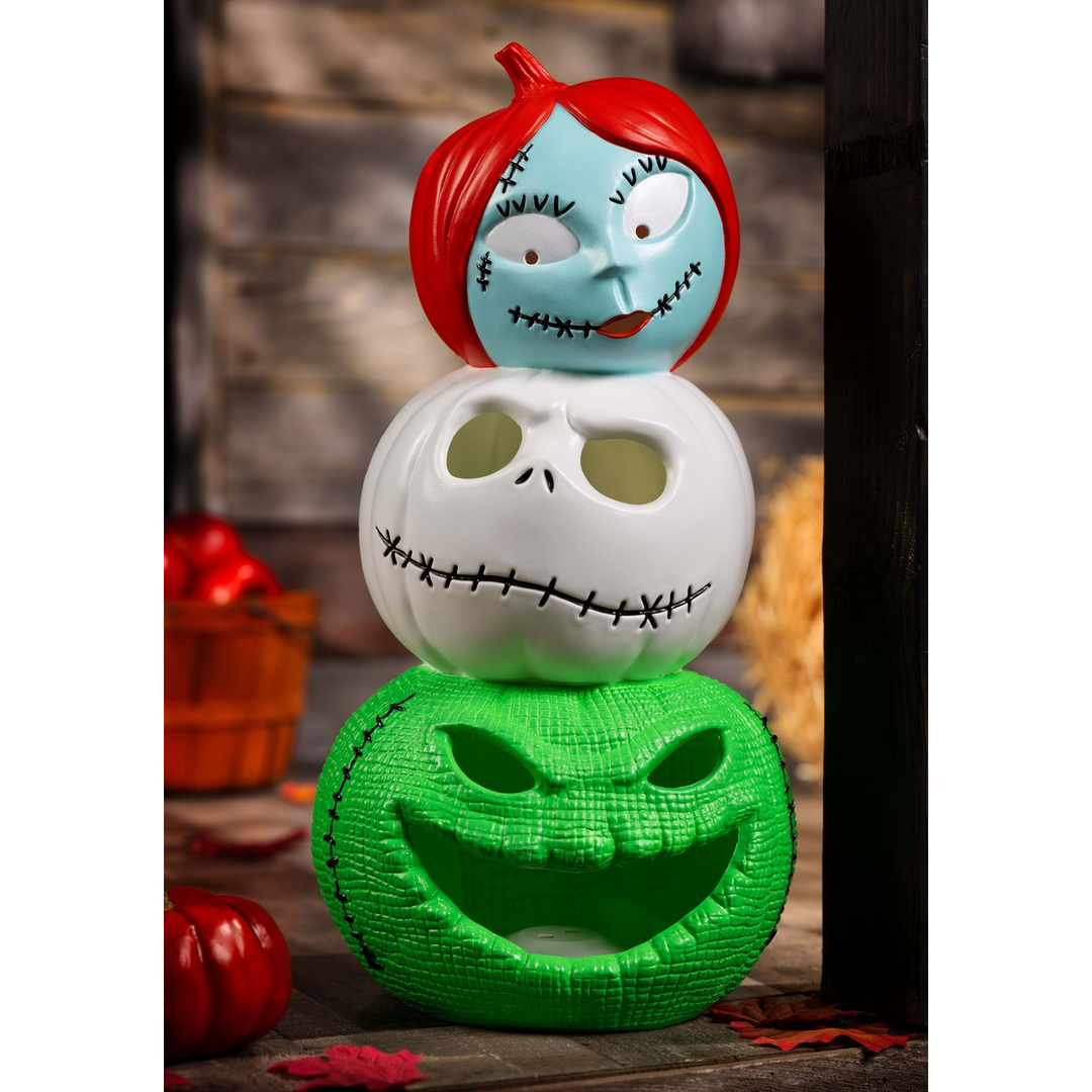 Light-up pumpkin decoration with Jack, Sally, and Oogie Boogie characters