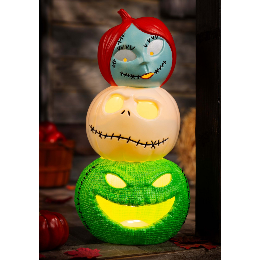 Light-up pumpkin decoration with Jack, Sally, and Oogie Boogie characters