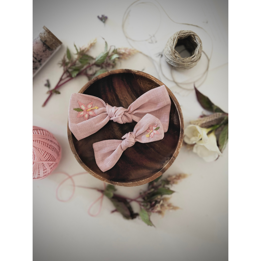 Embroidered linen bow with alligator clip attachment
