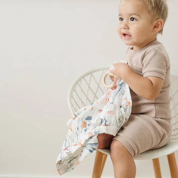 Bebe Au Lait narwhal muslin teether blanket with beechwood teether