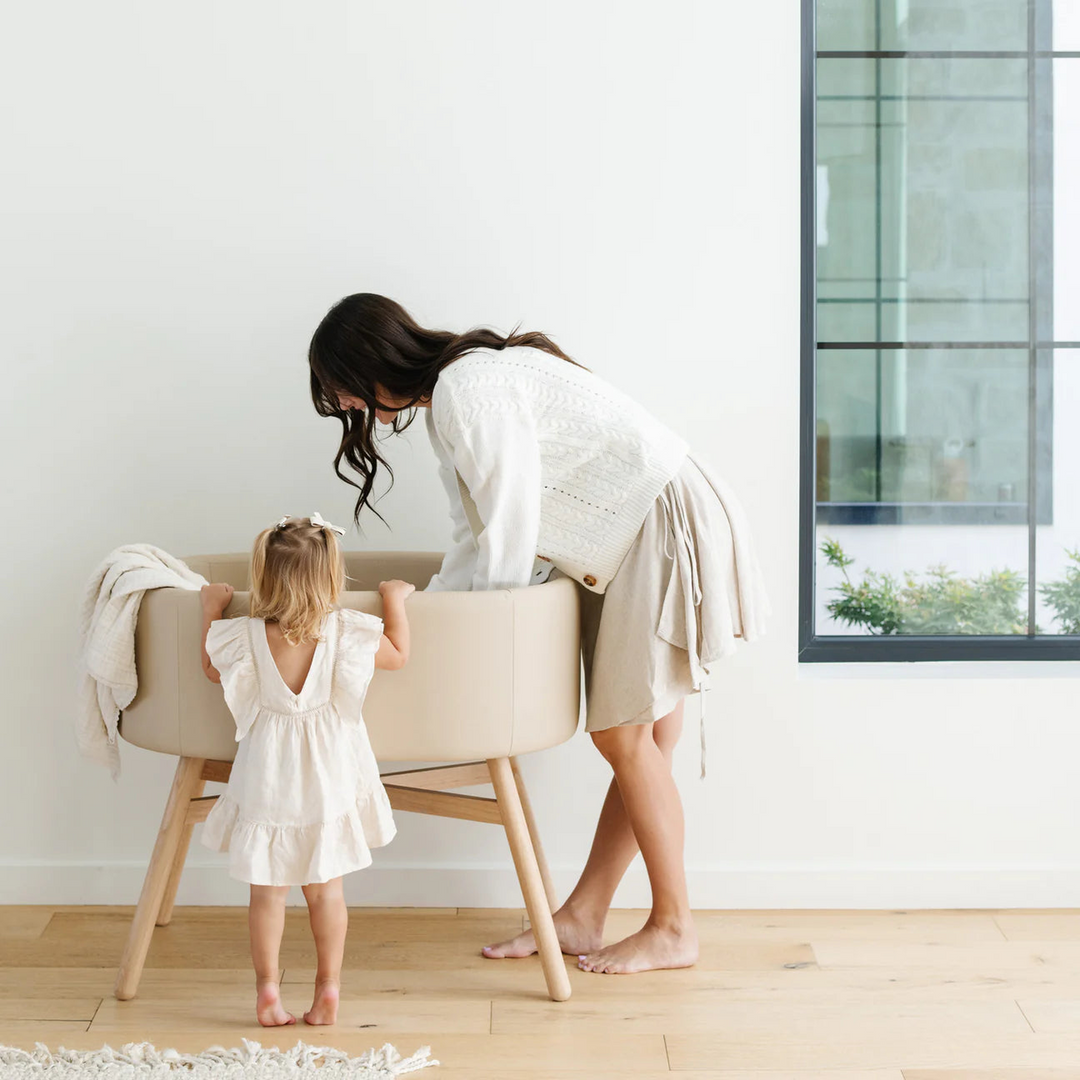 Babyletto x GATHRE Millet capsule bassinet with rounded rubberwood legs