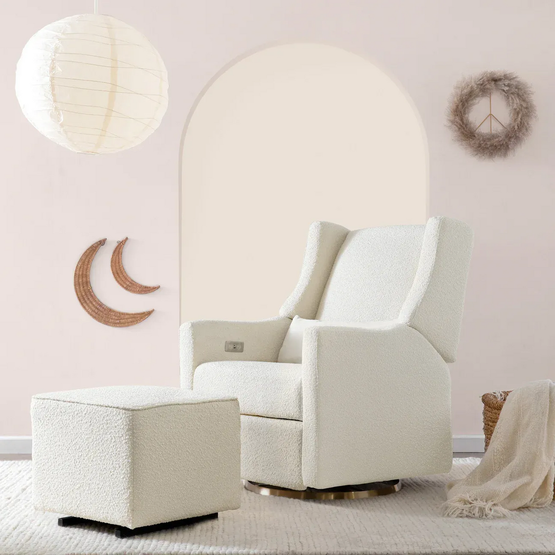 Babyletto ivory boucle gliding ottoman with gold-tone base