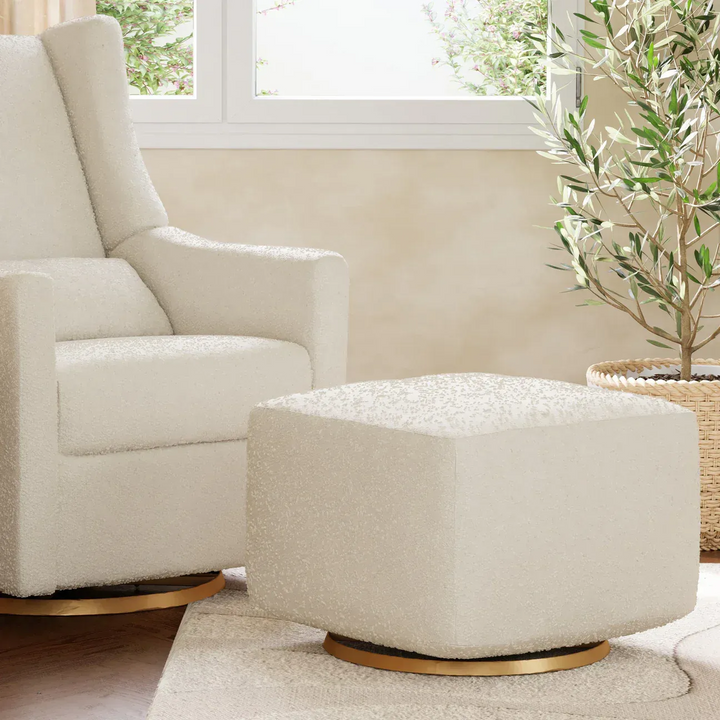 Babyletto gliding ottoman in ivory boucle with golden base