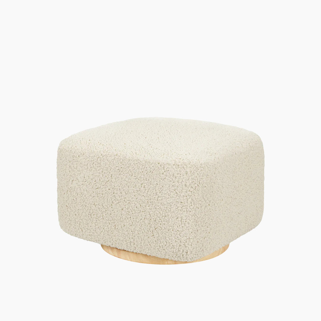 Babyletto ottoman in teddy loop fabric with a light wood base