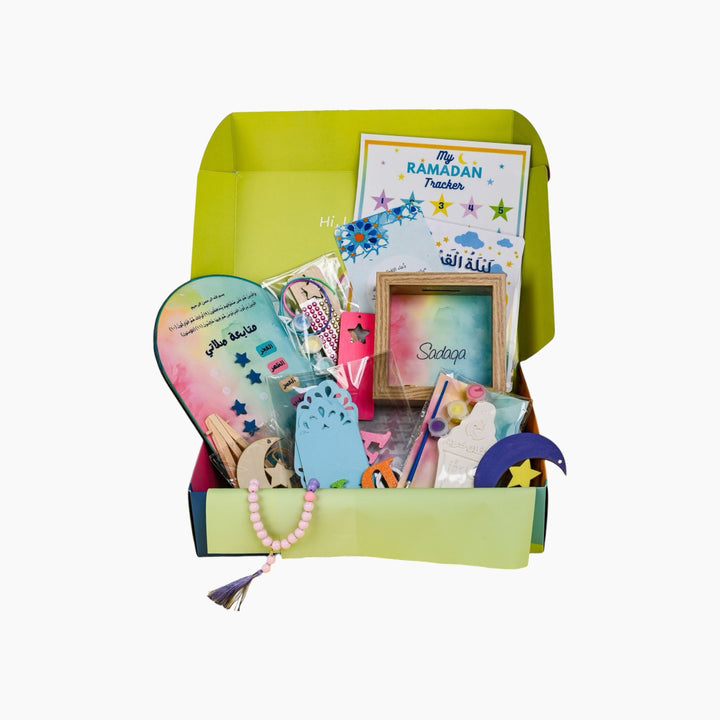 Ramadan crafts box with sadaqa box, wooden bookmark, paints, stickers, prayer tracker, banner, and beads