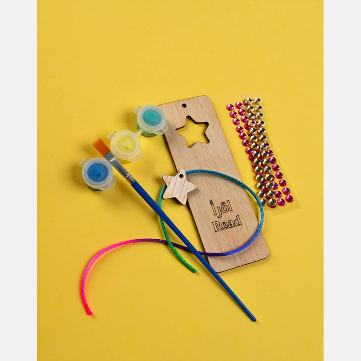 Ramadan crafts box with sadaqa box, bookmark, paints, stickers, prayer tracker, banner, and beads