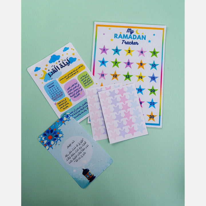 Ramadan crafts box with sadaqa box, bookmark, paints, stickers, prayer tracker, banner, and beads