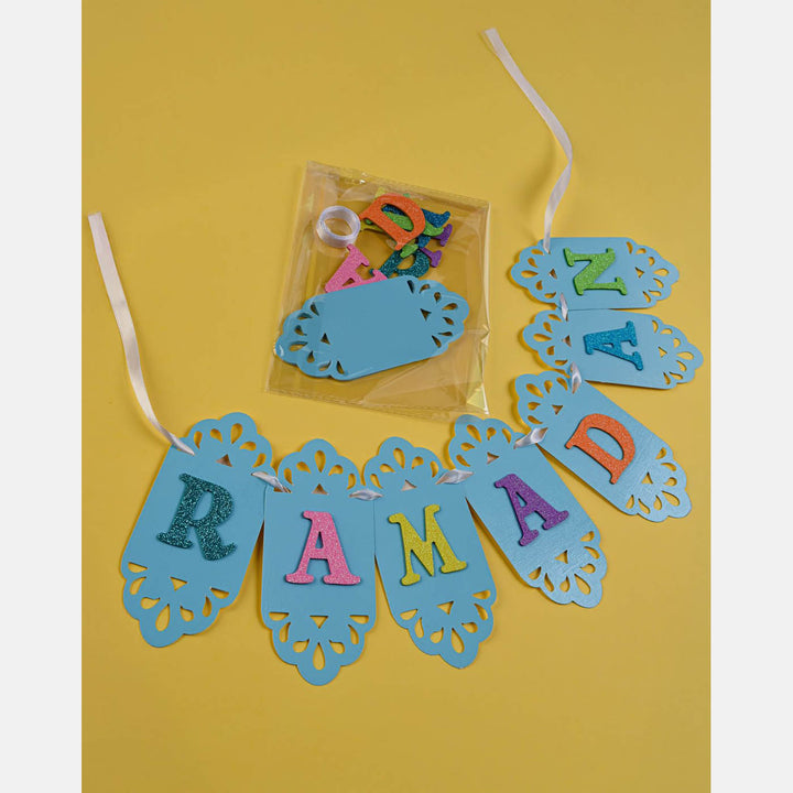 Wenzo Ramadan crafts box with sadaqa box, bookmark, paints, stickers, prayer tracker, banner, and beads