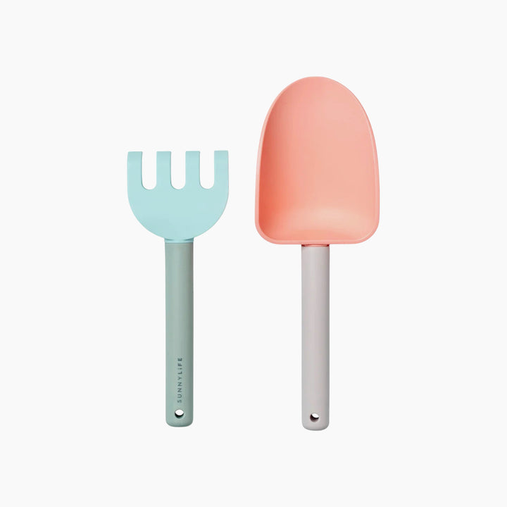 SunnyLife silicone sand spade and rake in Apple Sorbet color