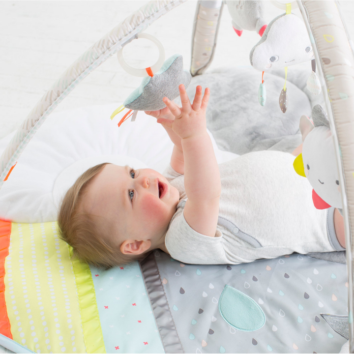 Skip Hop Silver Lining Cloud Activity Gym with celestial-themed toys