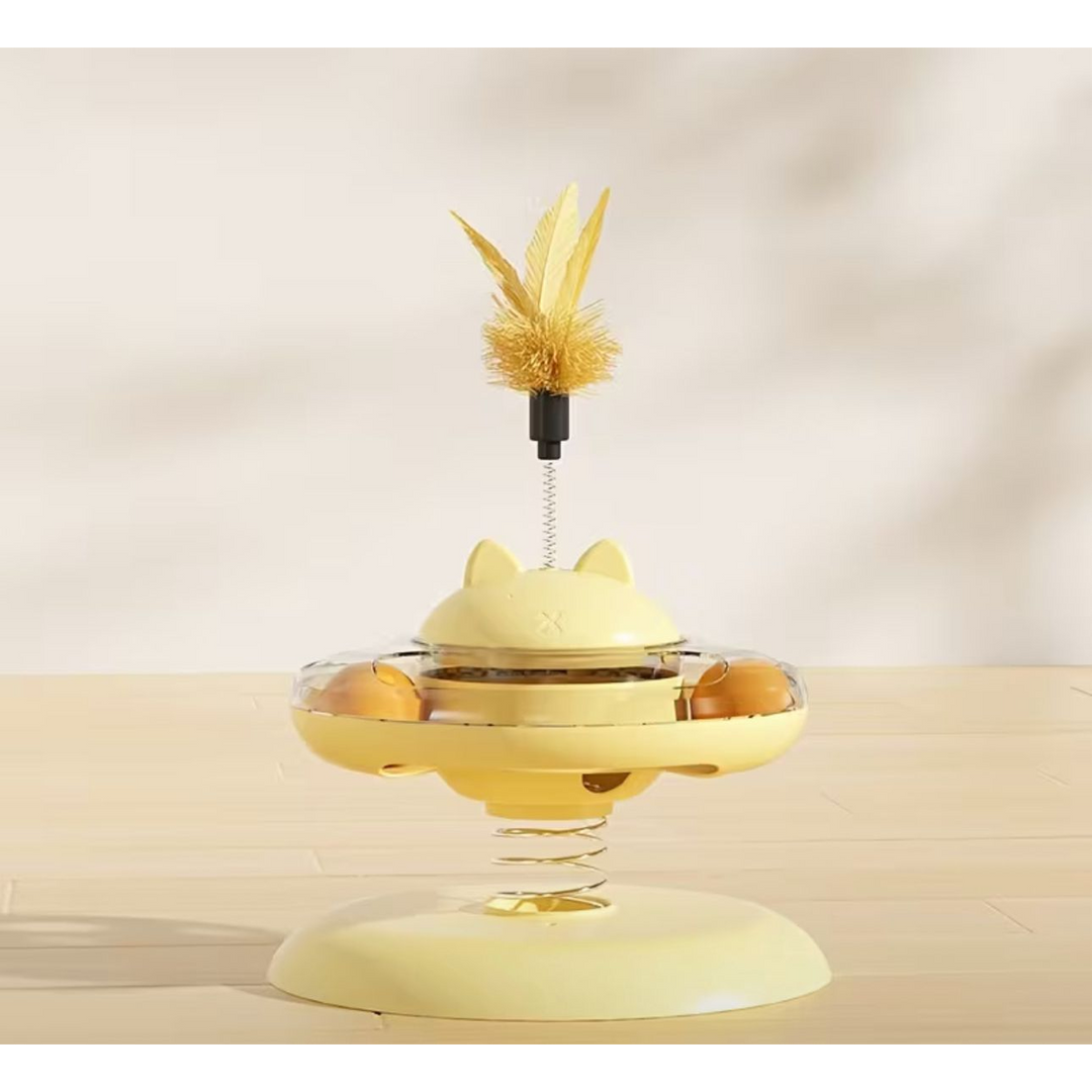 Village Care interactive yellow cat toy with treat dispenser