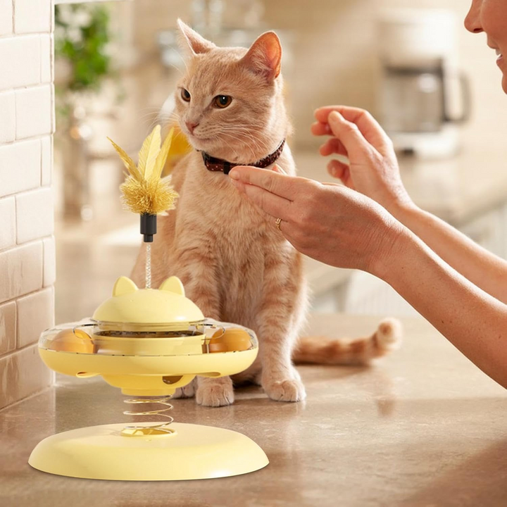 Village Care yellow interactive cat toy with treat dispenser