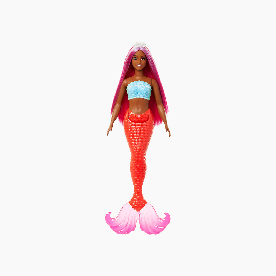 Barbie mermaid doll with magenta hair, curvy body, shell bodice, and tropical red tail